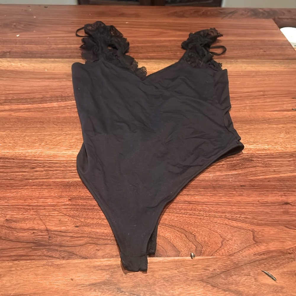 Black ruffled bodysuit